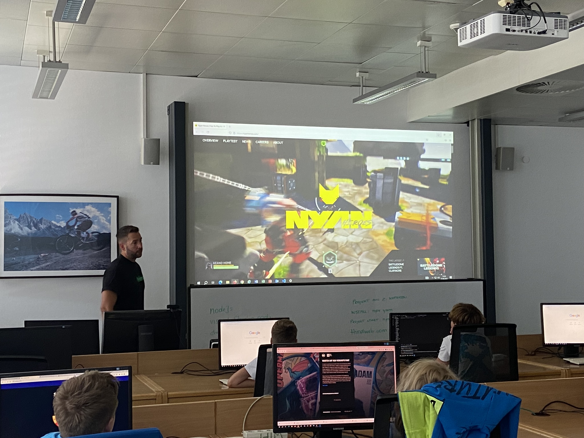 Blockchain class with NYAN Hero game on projector at Coding4Kids 2023