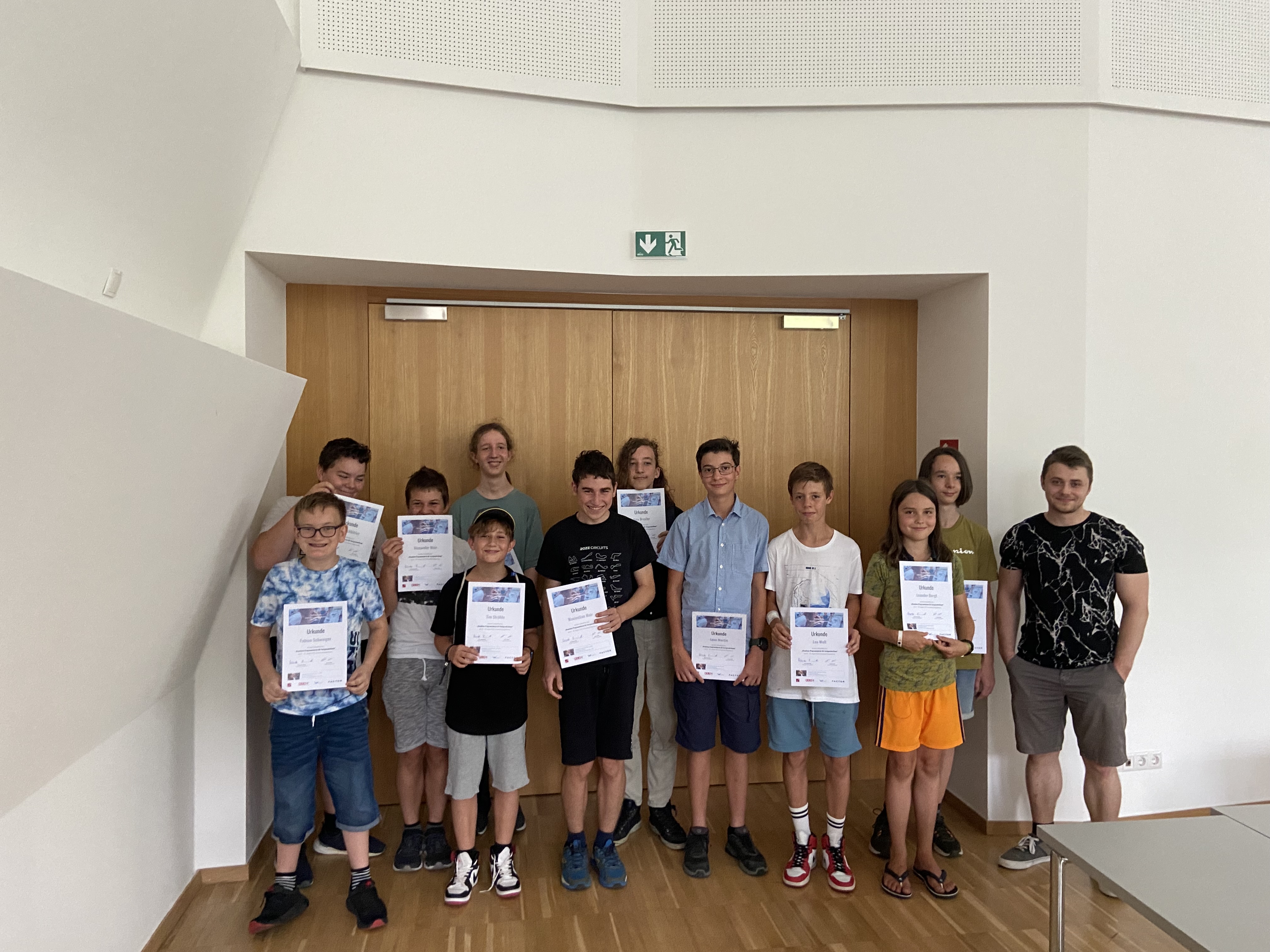 Kids holding blockchain certificates at Coding4Kids 2022