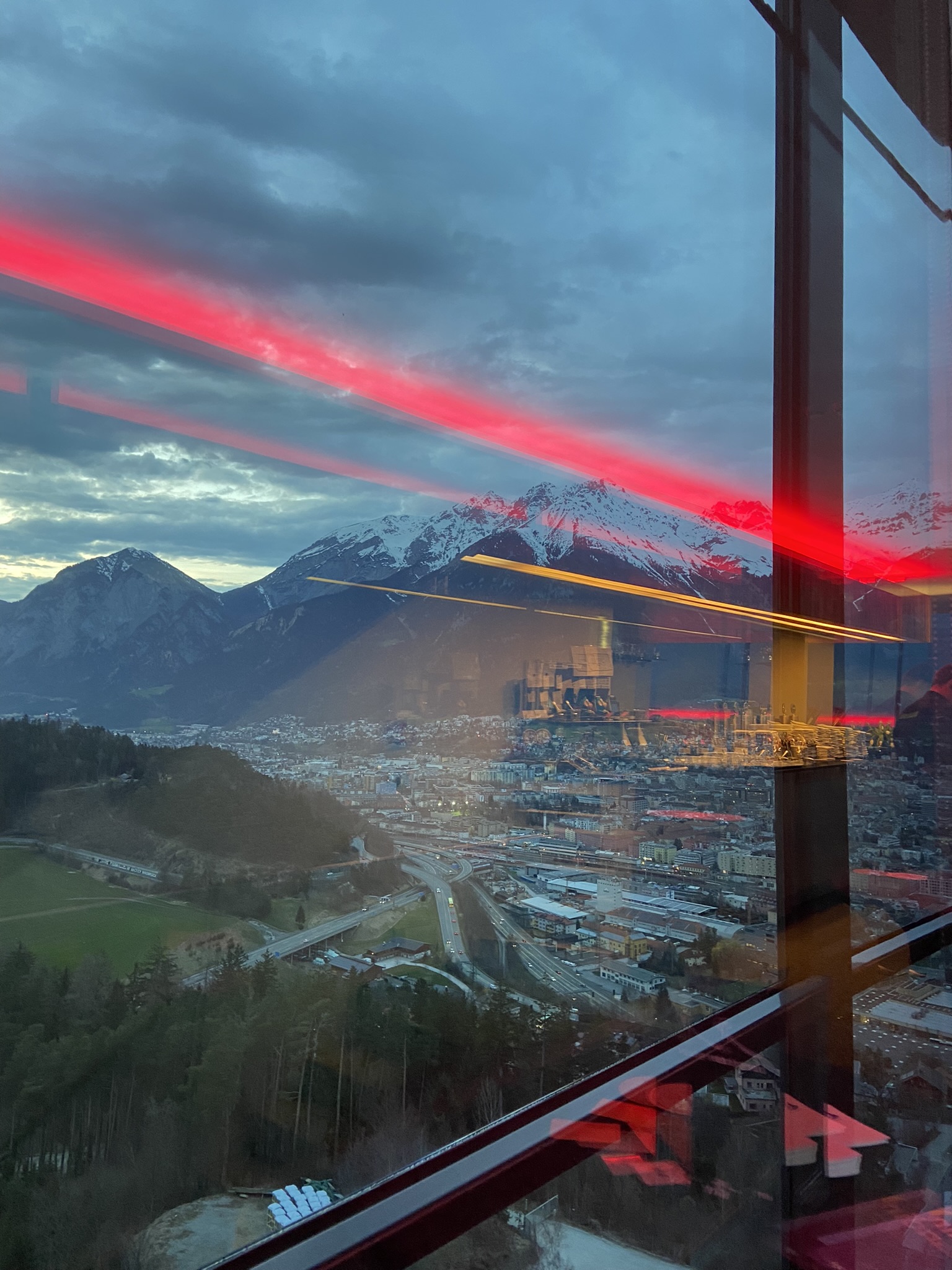 Innsbruck alpine city panorama with red glass reflection at Hybriqe 2024