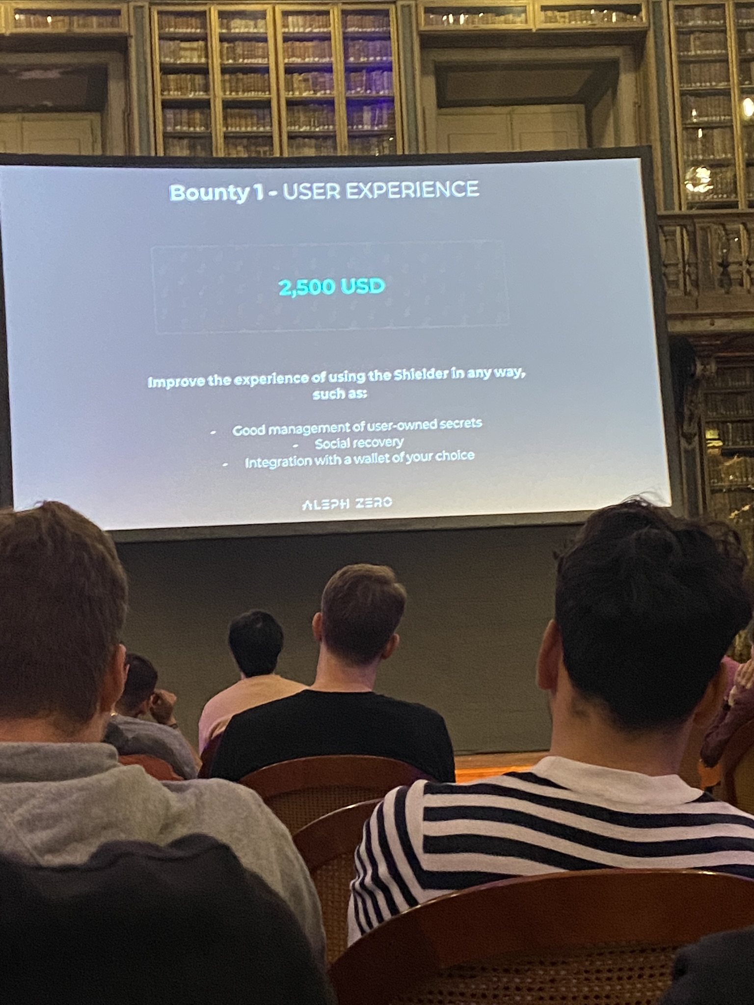 Hackathon bounty session in ornate Lisbon library at ZkHack 2023